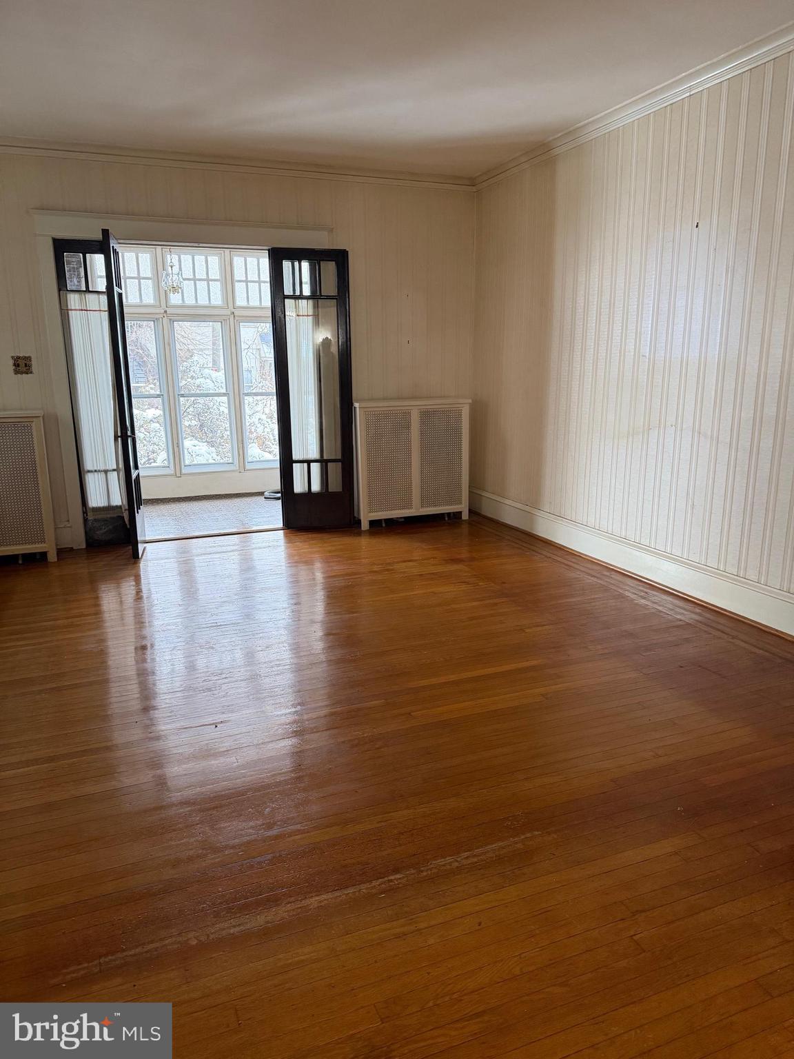 4640 Adams Avenue Philadelphia, PA 19124 - Photo 30 of 34 a view of an empty room with window and wooden floor