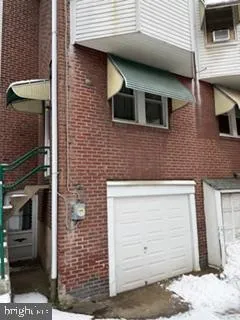 a view of a brick house with large windows