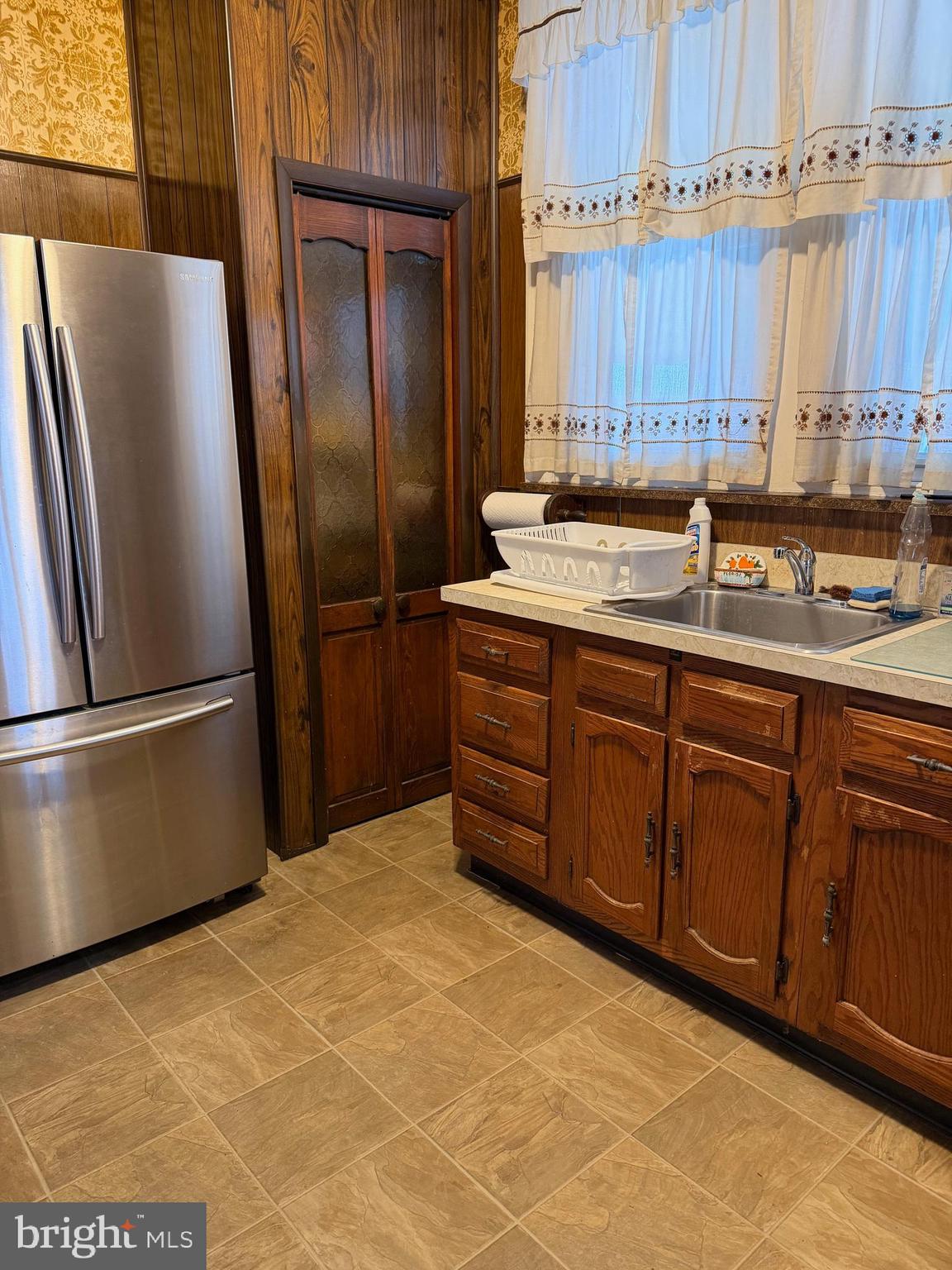 4640 Adams Avenue Philadelphia, PA 19124 - Photo 5 of 34 a kitchen with stainless steel appliances granite countertop a refrigerator a sink and a stove