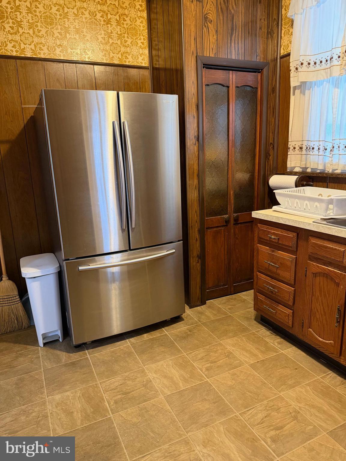 4640 Adams Avenue Philadelphia, PA 19124 - Photo 6 of 34 a kitchen with stainless steel appliances granite countertop a refrigerator a sink and a stove