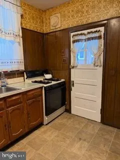 a kitchen with a stove and a cabinet
