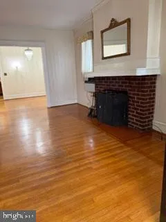 a view of a livingroom with wooden floor