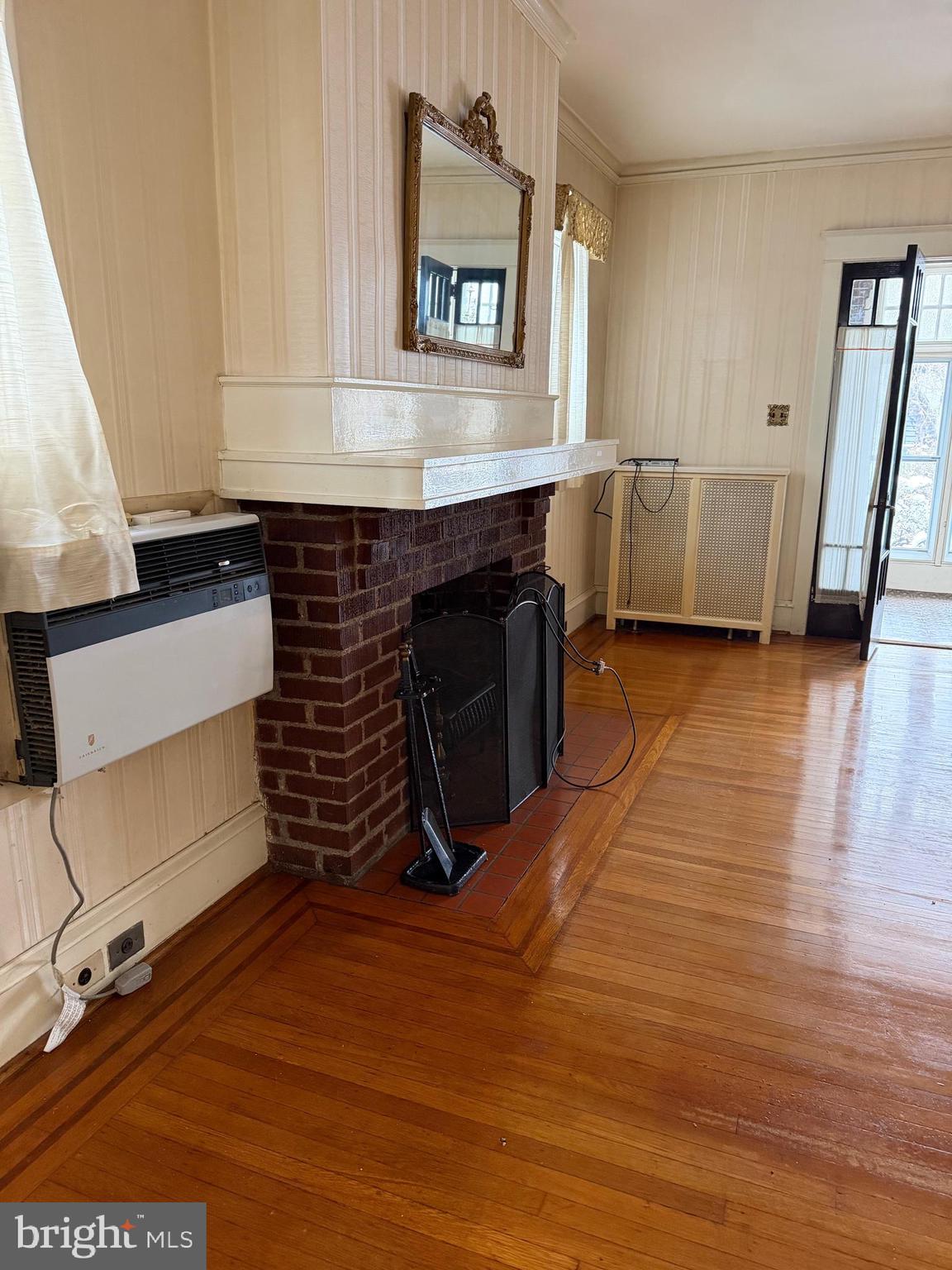 4640 Adams Avenue Philadelphia, PA 19124 - Photo 9 of 34 a room with wooden floors and stairs