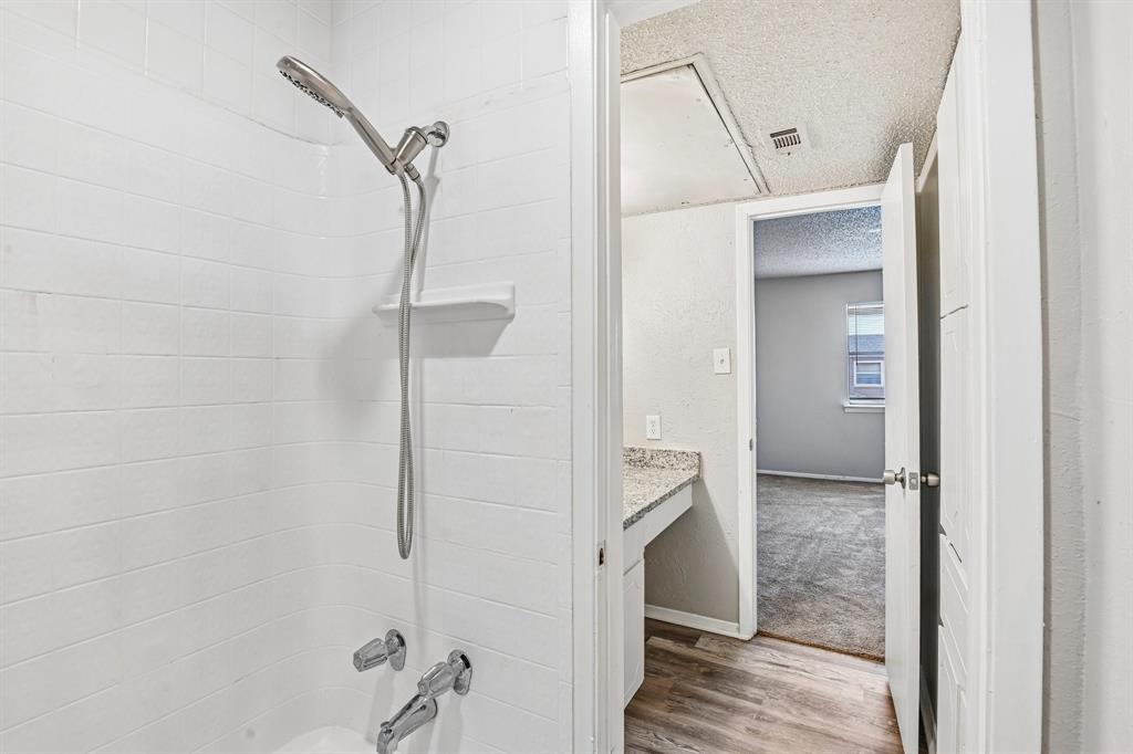 5534 Boca Raton Boulevard, Unit 292 Fort Worth, TX 76112 - Photo 22 of 31 a bathroom with a shower