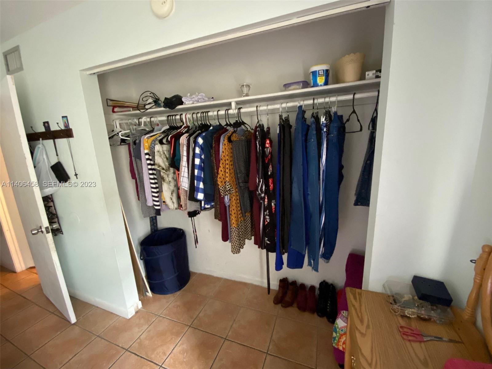 9227 Southwest 87th Avenue, Unit B7 Miami, FL 33176 - Photo 13 of 21 a view of walk in closet with clothes and shoes