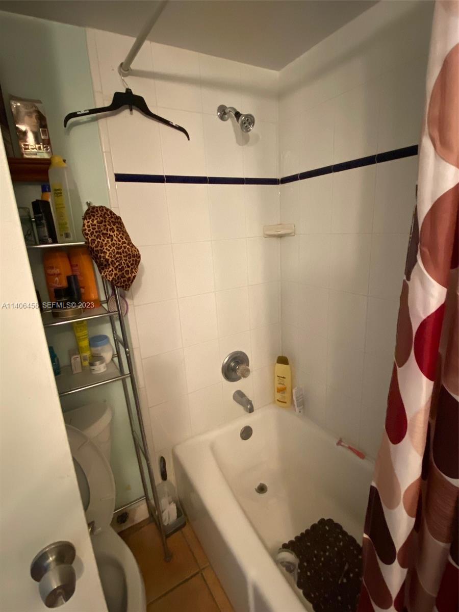 9227 Southwest 87th Avenue, Unit B7 Miami, FL 33176 - Photo 19 of 21 a bathroom with a sink and a shower
