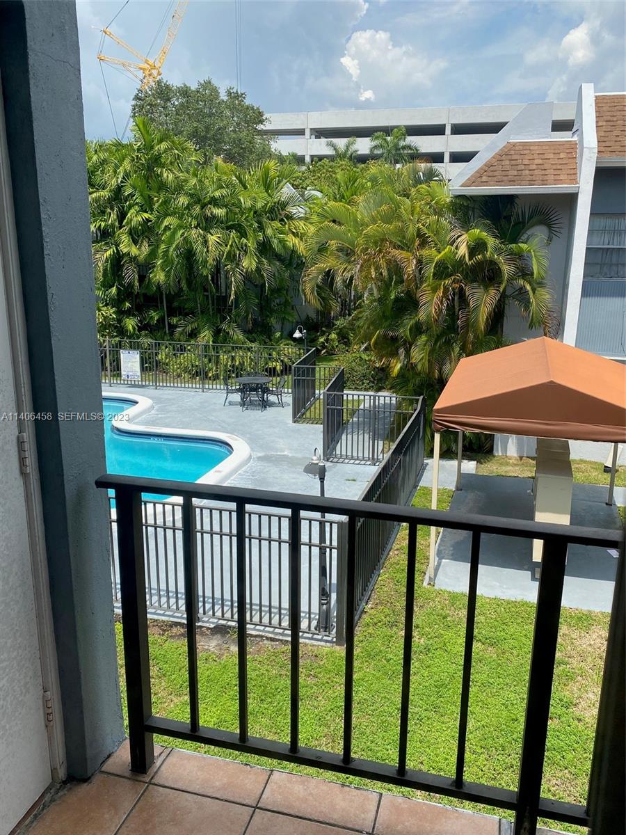 9227 Southwest 87th Avenue, Unit B7 Miami, FL 33176 - Photo 20 of 21 a view of a balcony with an outdoor space