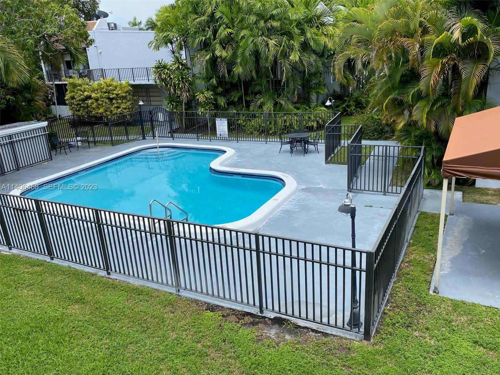 9227 Southwest 87th Avenue, Unit B7 Miami, FL 33176 - Photo 21 of 21 a view of a backyard and porch