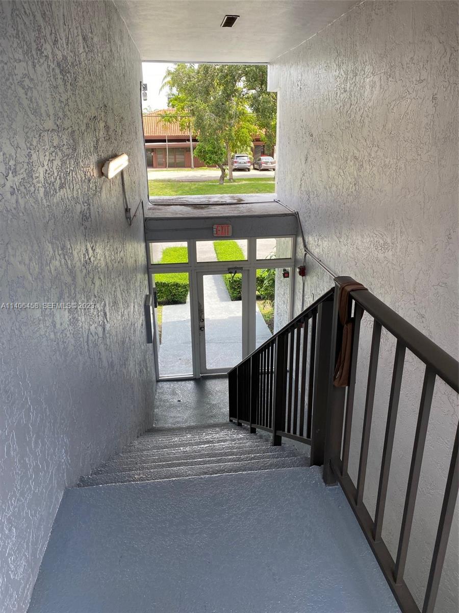 9227 Southwest 87th Avenue, Unit B7 Miami, FL 33176 - Photo 7 of 21 a view of a porch with a floor to ceiling window