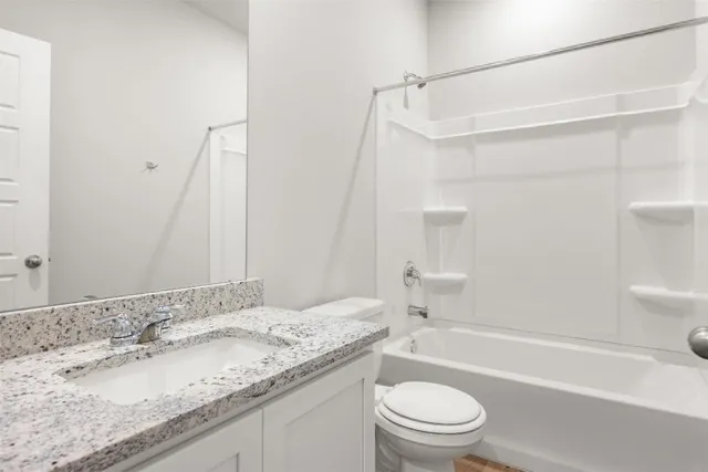 a view of a kitchen with wooden floor and a kitchen