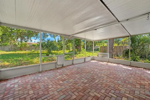 a view of a room with porch and wooden floor