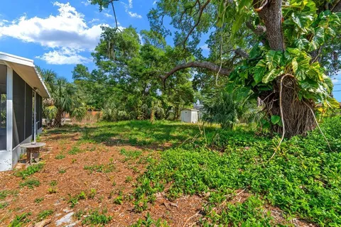 a backyard of a house with lots of green space