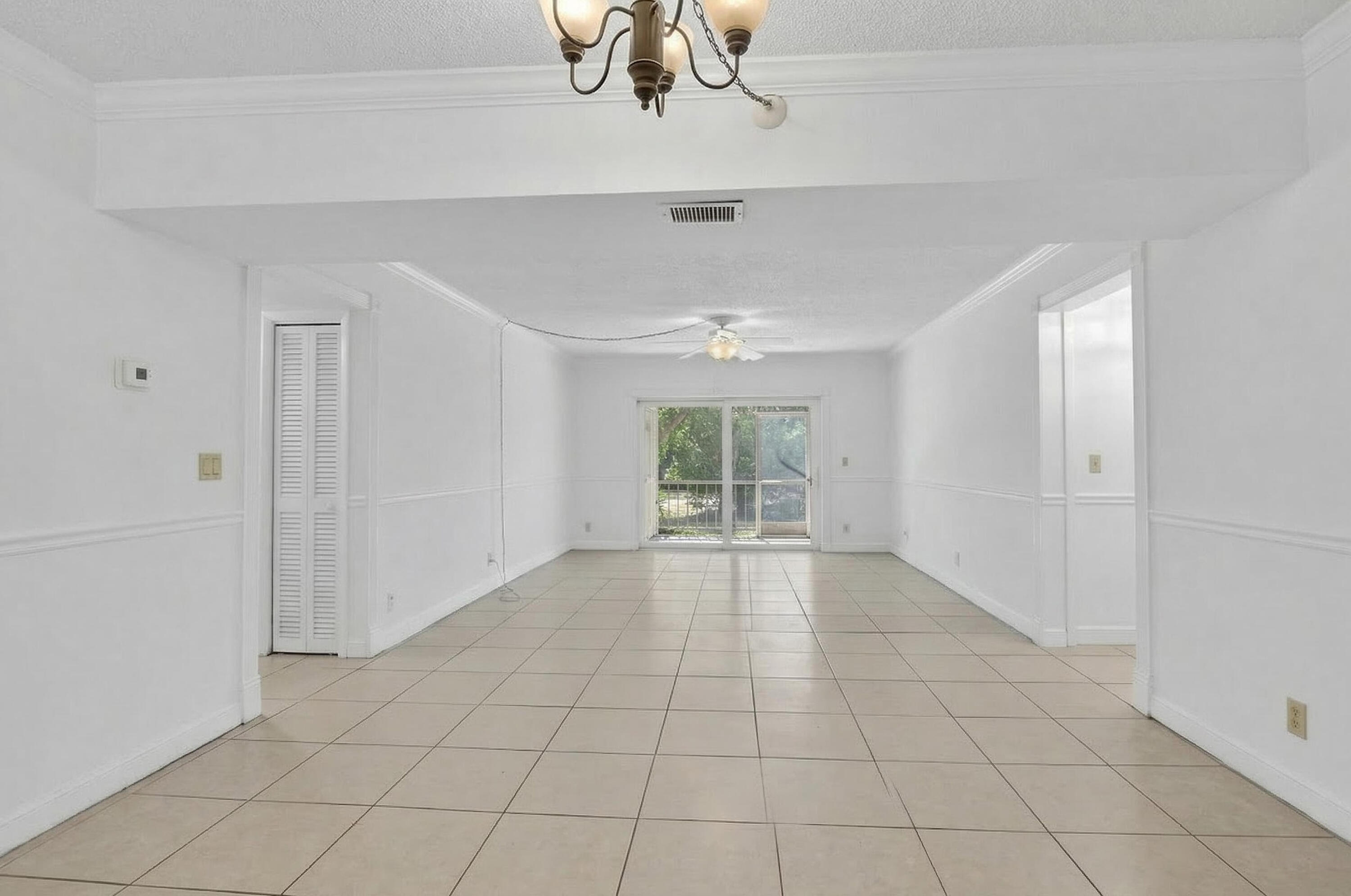 636 Northwest 13th Street, Unit 110 Boca Raton, FL 33486 - Photo 7 of 35 a view of an empty room with a window