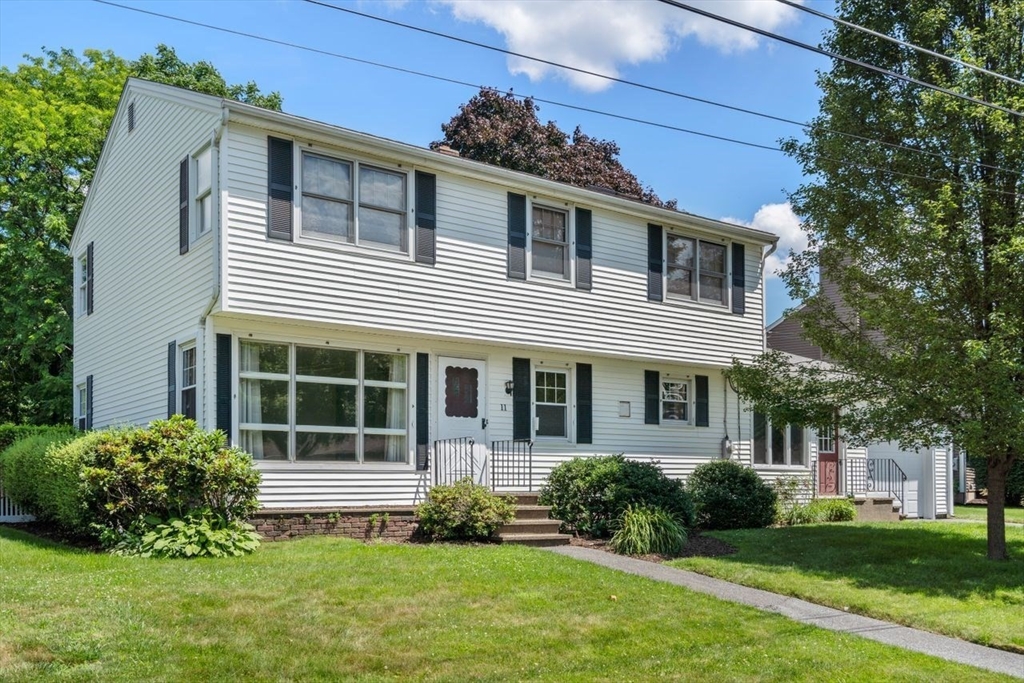 11 Gloucester Road Grafton, MA 01536 - Photo 1 of 38 a view of a house with a yard and plants