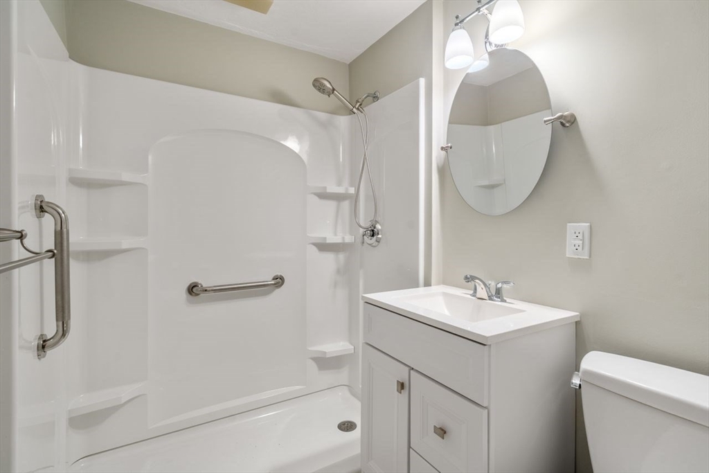 11 Gloucester Road Grafton, MA 01536 - Photo 14 of 38 a bathroom with a sink a toilet and shower