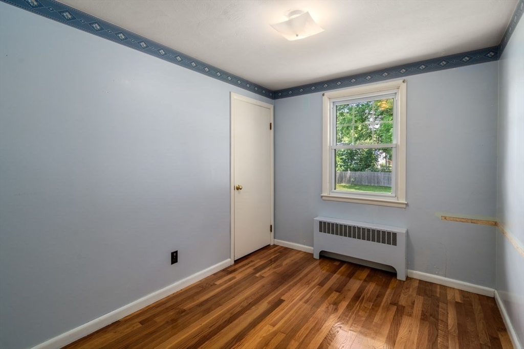 11 Gloucester Road Grafton, MA 01536 - Photo 18 of 38 a view of room with window and hardwood floor