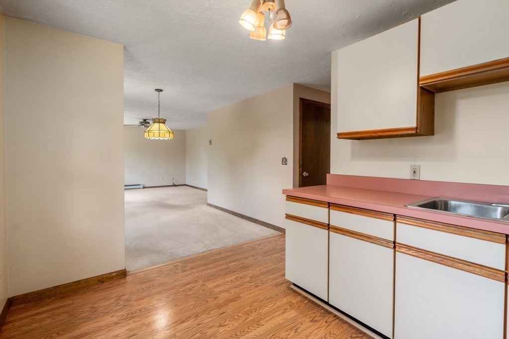 11 Gloucester Road Grafton, MA 01536 - Photo 20 of 38 a view of cabinets and wooden floor