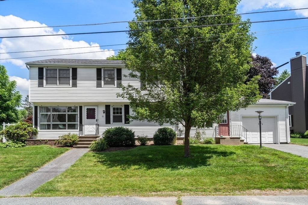 11 Gloucester Road Grafton, MA 01536 - Photo 2 of 38 a front view of a house with a yard