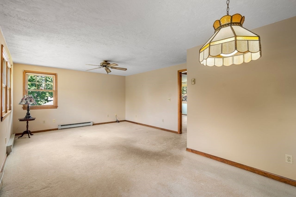 11 Gloucester Road Grafton, MA 01536 - Photo 22 of 38 an empty room with windows and glass door