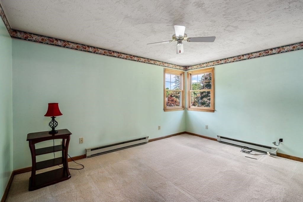 11 Gloucester Road Grafton, MA 01536 - Photo 25 of 38 an empty room with windows and fan