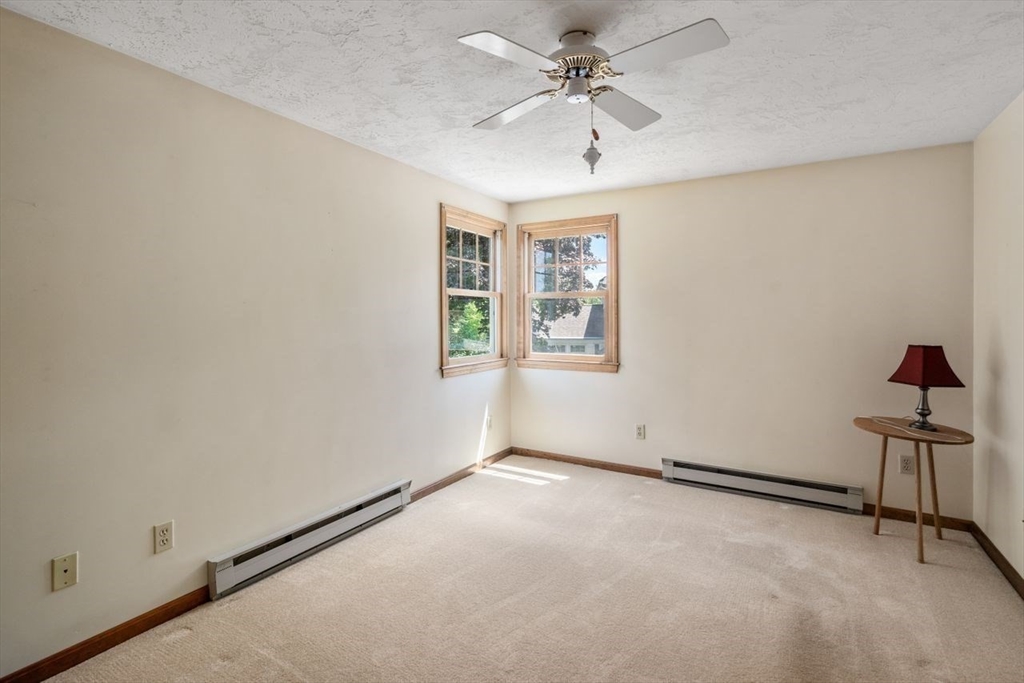 11 Gloucester Road Grafton, MA 01536 - Photo 26 of 38 an empty room with windows and fan