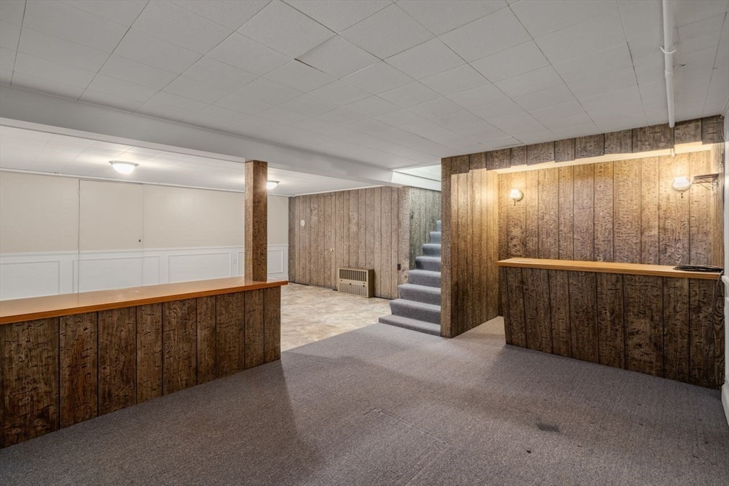 11 Gloucester Road Grafton, MA 01536 - Photo 29 of 38 a view of an empty room with wooden walls