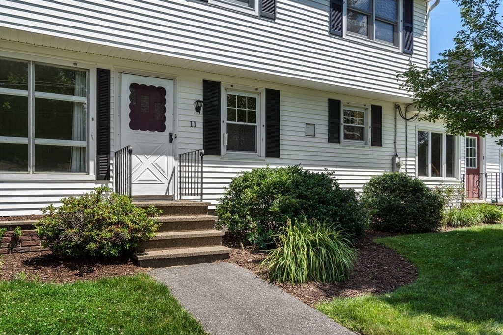 11 Gloucester Road Grafton, MA 01536 - Photo 3 of 38 a front view of a house with garden