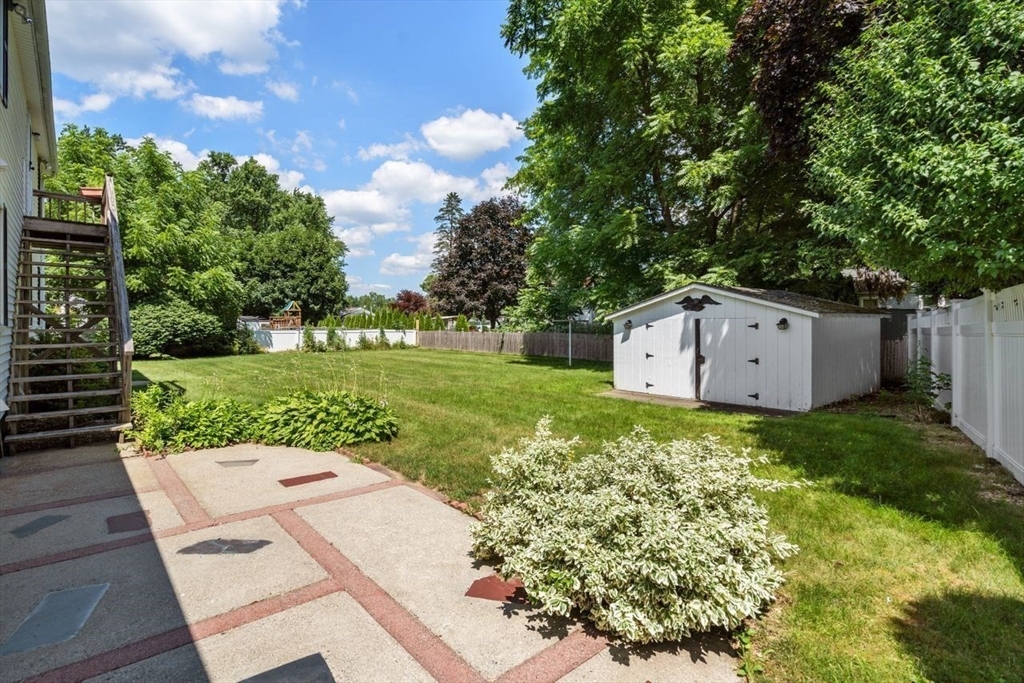 11 Gloucester Road Grafton, MA 01536 - Photo 34 of 38 a backyard of a house with lots of green space