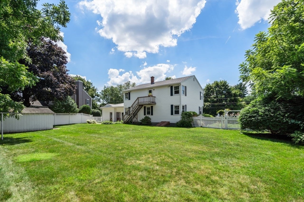 11 Gloucester Road Grafton, MA 01536 - Photo 35 of 38 a view of a house with a yard and garage
