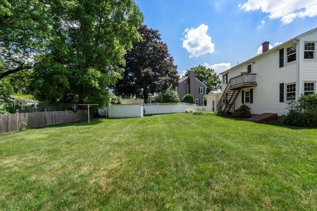 11 Gloucester Road Grafton, MA 01536 - Photo 36 of 38 a backyard of a house with lots of green space