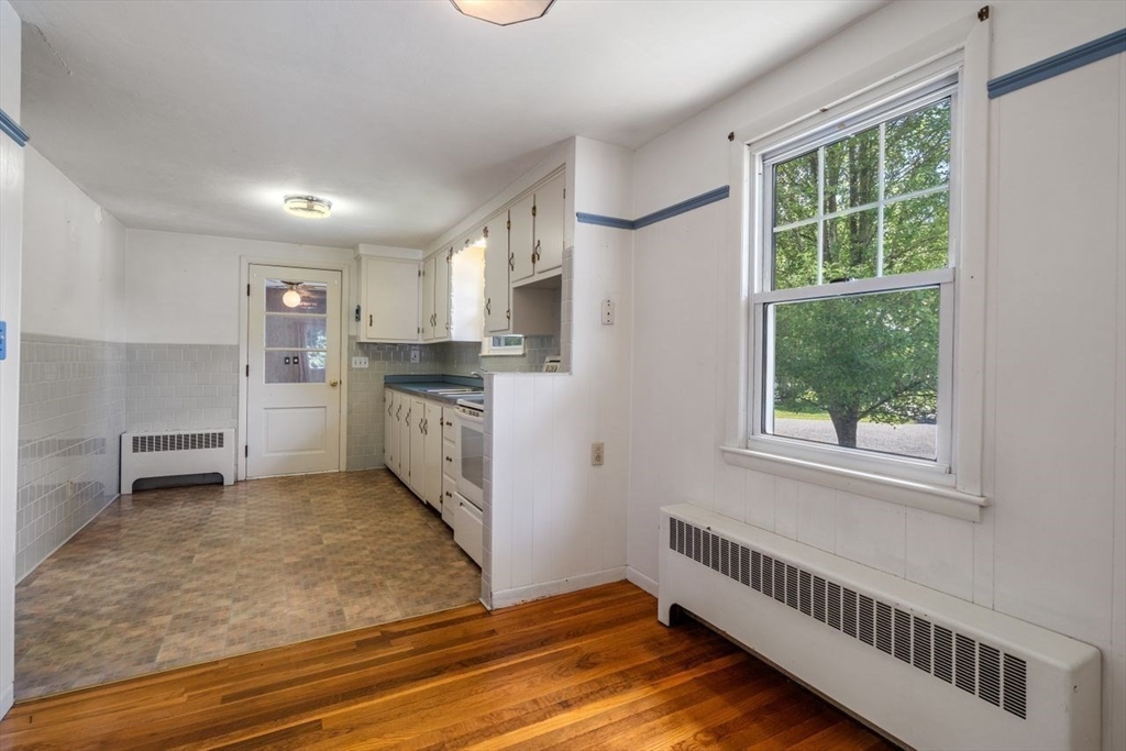 11 Gloucester Road Grafton, MA 01536 - Photo 6 of 38 a kitchen with stainless steel appliances granite countertop a stove a sink and a refrigerator