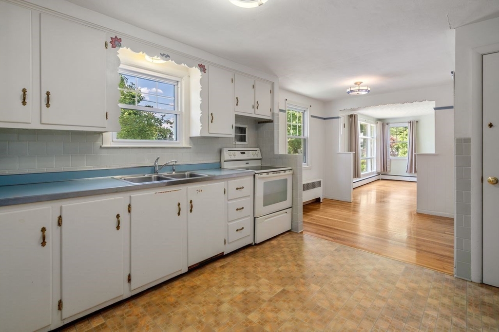 11 Gloucester Road Grafton, MA 01536 - Photo 9 of 38 a kitchen with sink and cabinets