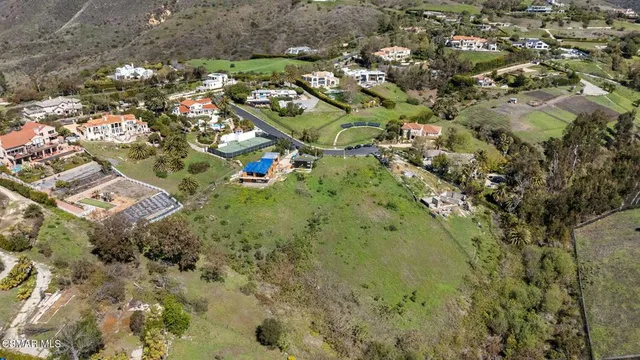 an aerial view of residential house with parking space