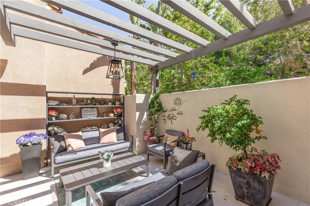 78 Bower Tree Irvine, CA 92603 - Photo 12 of 25 a outdoor living room with furniture