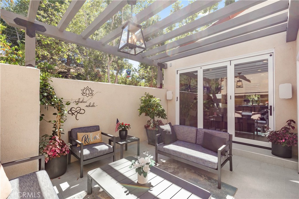 78 Bower Tree Irvine, CA 92603 - Photo 13 of 25 a outdoor space with patio the couches and a dining table with chairs