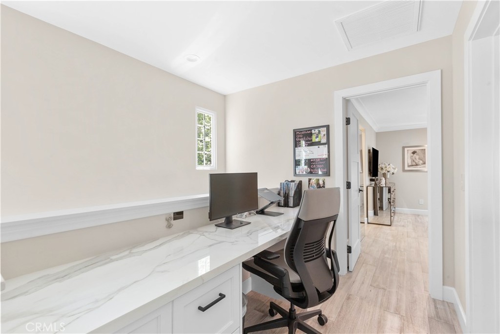 78 Bower Tree Irvine, CA 92603 - Photo 15 of 25 a view of a workspace with furniture and wooden floor