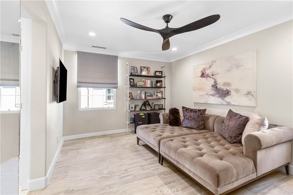 78 Bower Tree Irvine, CA 92603 - Photo 16 of 25 a living room with furniture and a flat screen tv