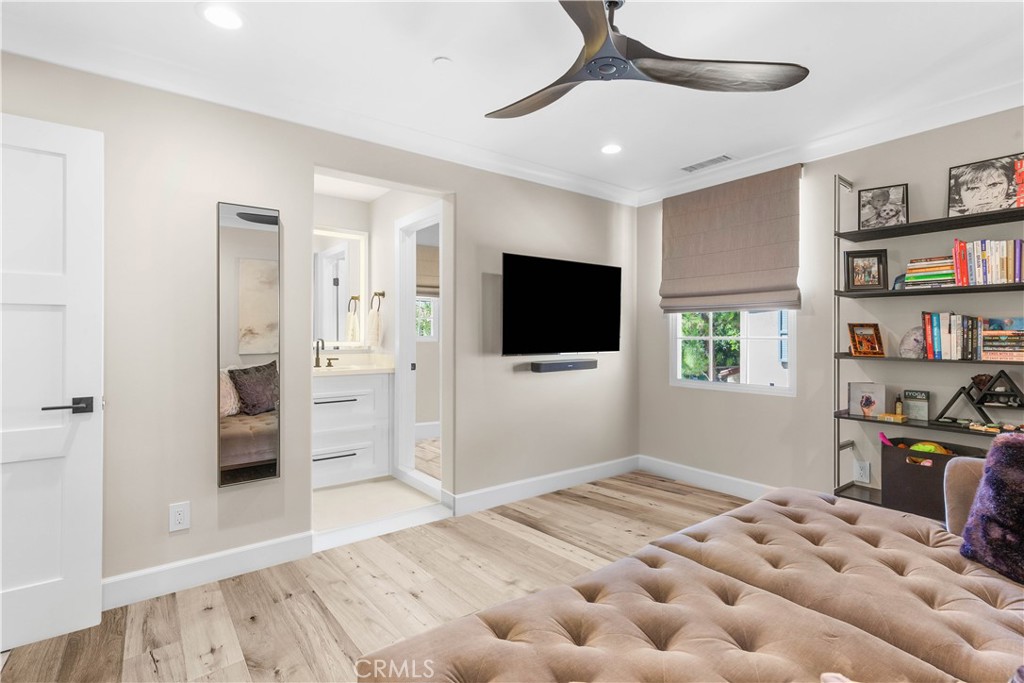 78 Bower Tree Irvine, CA 92603 - Photo 17 of 25 a bedroom with furniture and a flat screen tv