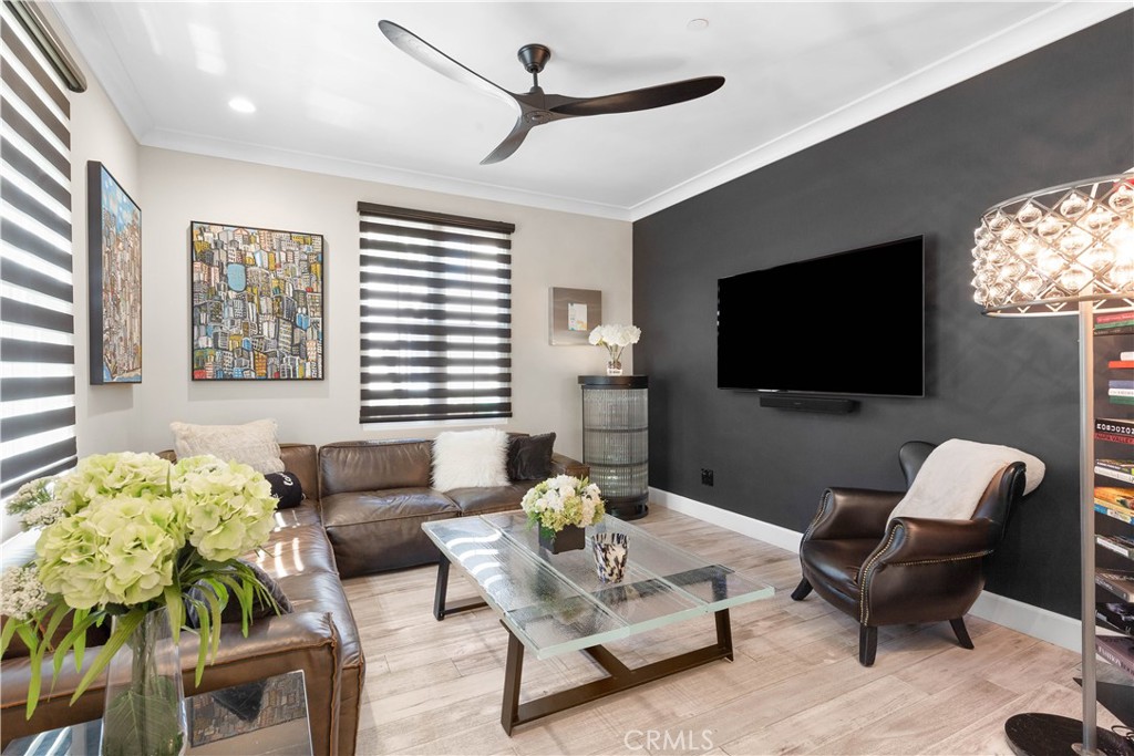 78 Bower Tree Irvine, CA 92603 - Photo 3 of 25 a living room with furniture a flat screen tv and a window