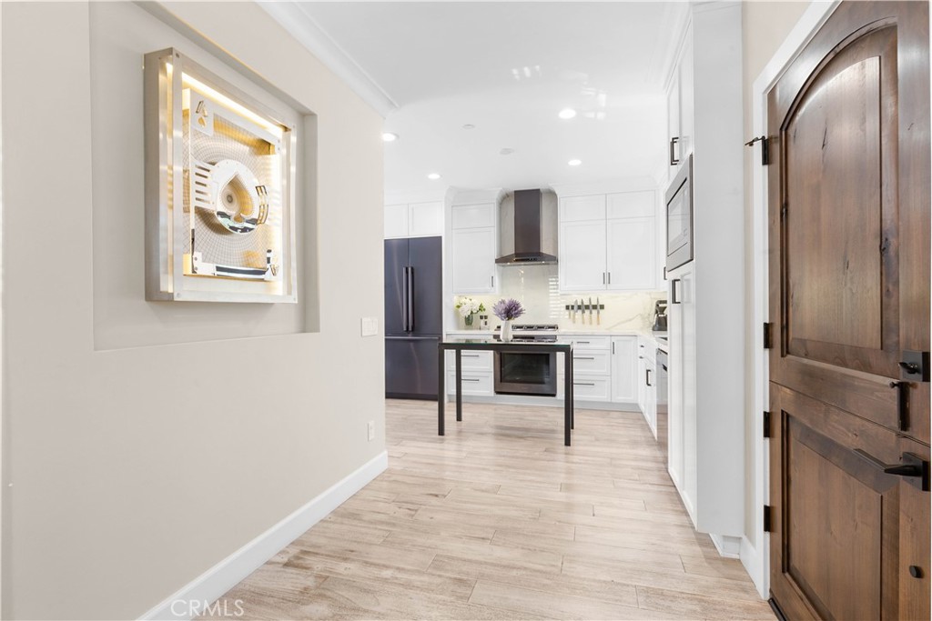 78 Bower Tree Irvine, CA 92603 - Photo 5 of 25 a kitchen with stainless steel appliances a refrigerator and a stove top oven