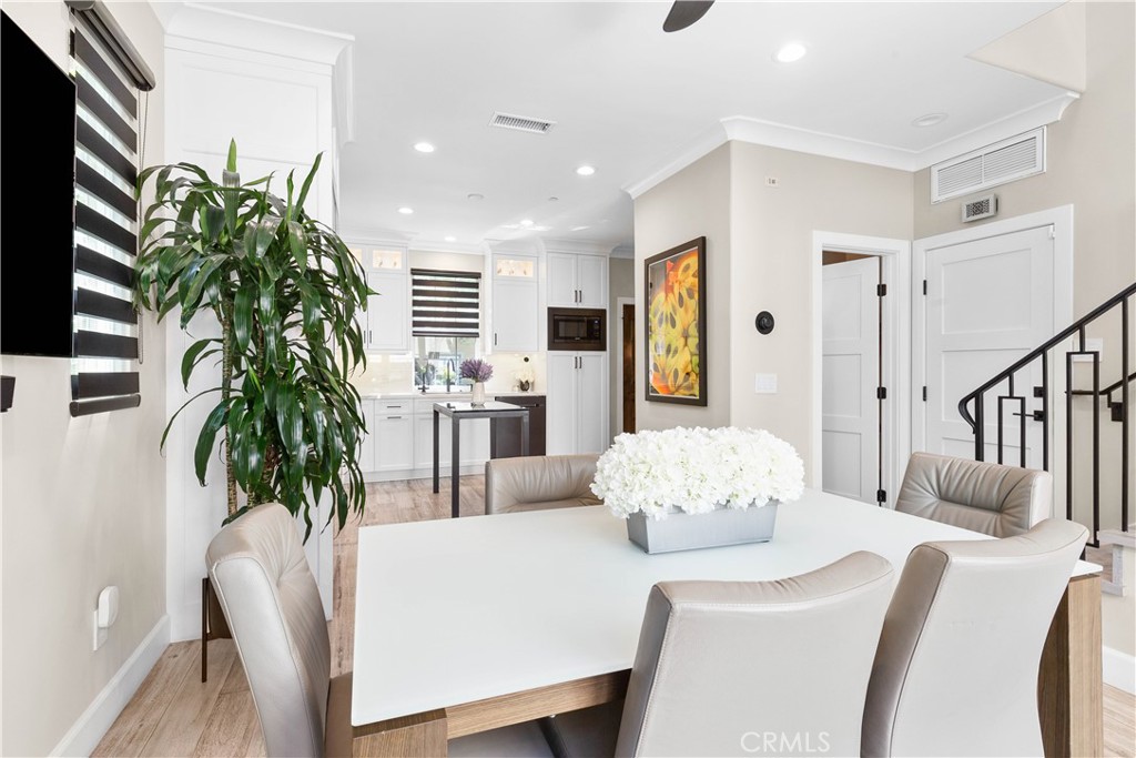 78 Bower Tree Irvine, CA 92603 - Photo 10 of 25 a living room with furniture and a potted plant