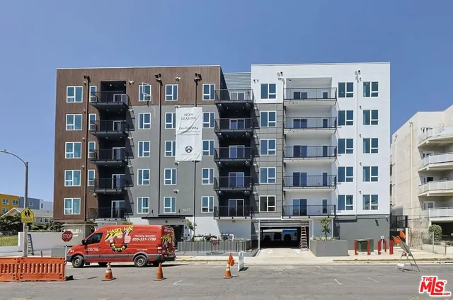 a cars parked in front of a building