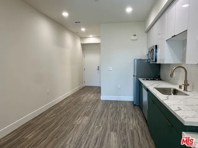 a view of a kitchen with sink and dishwasher