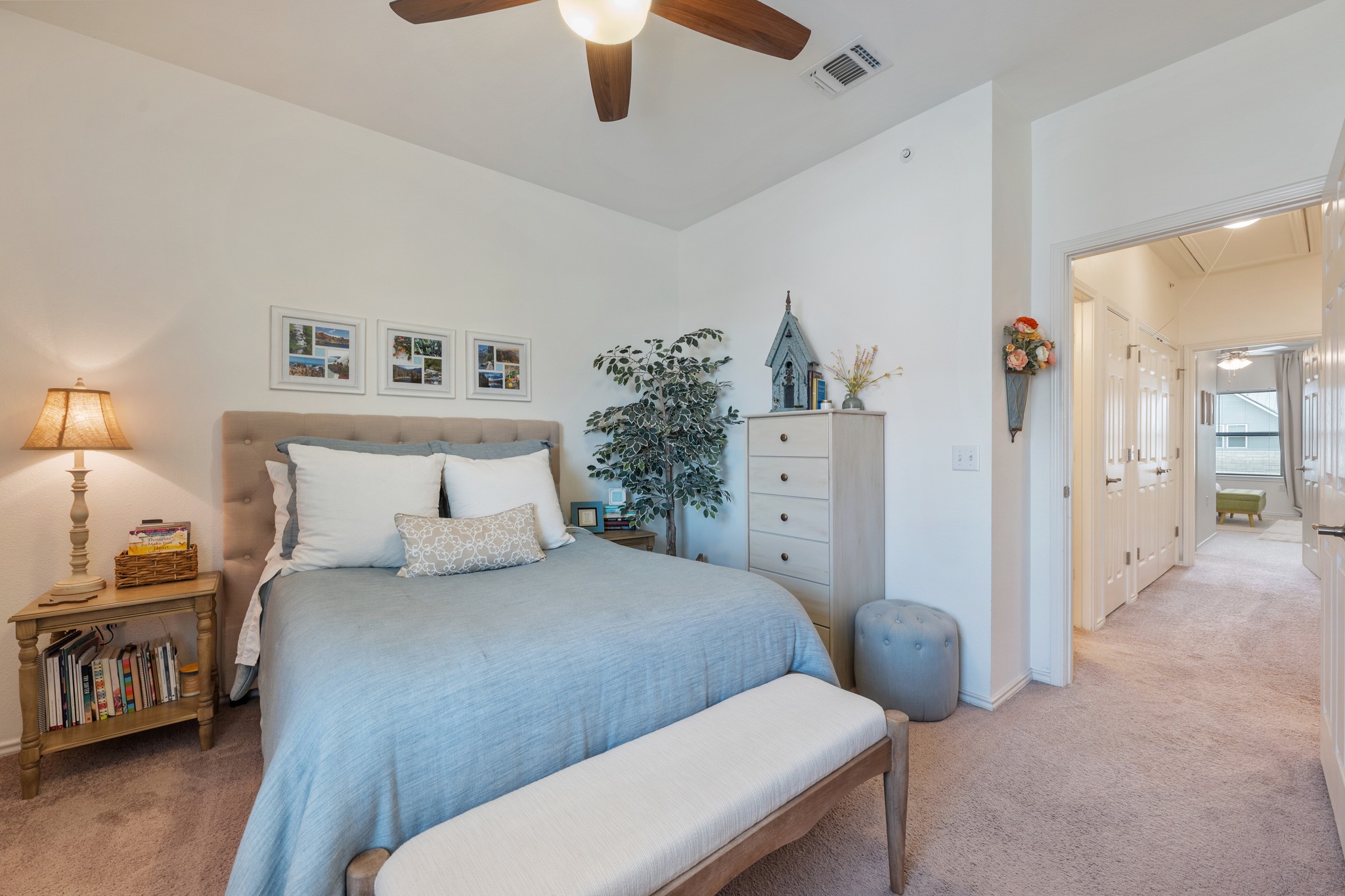 4400 Vaughan Street, Unit B Austin, TX 78723 - Photo 22 of 29 a bedroom with a bed and a chandelier