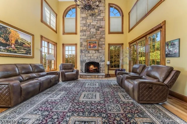 a living room with furniture rug and a fireplace