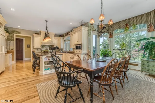 a large kitchen with stainless steel appliances granite countertop a stove and a sink