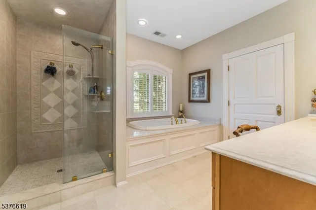 a bedroom with a bed window and couch