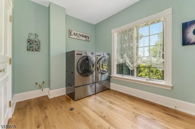 a living room with furniture fireplace and dining room