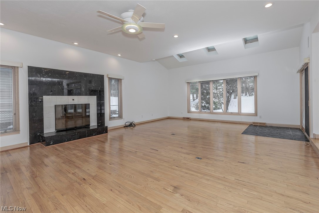 3850 Ellendale Road Moreland Hills, OH 44022 - Photo 8 of 39 Great room with hardwood flooring, ceiling fan, and a tiled fireplace