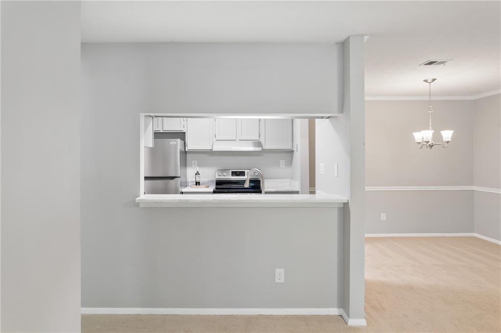1009 McClelen Way Decatur, GA 30033 - Photo 12 of 24 a kitchen with stainless steel appliances a sink a stove a refrigerator and cabinets